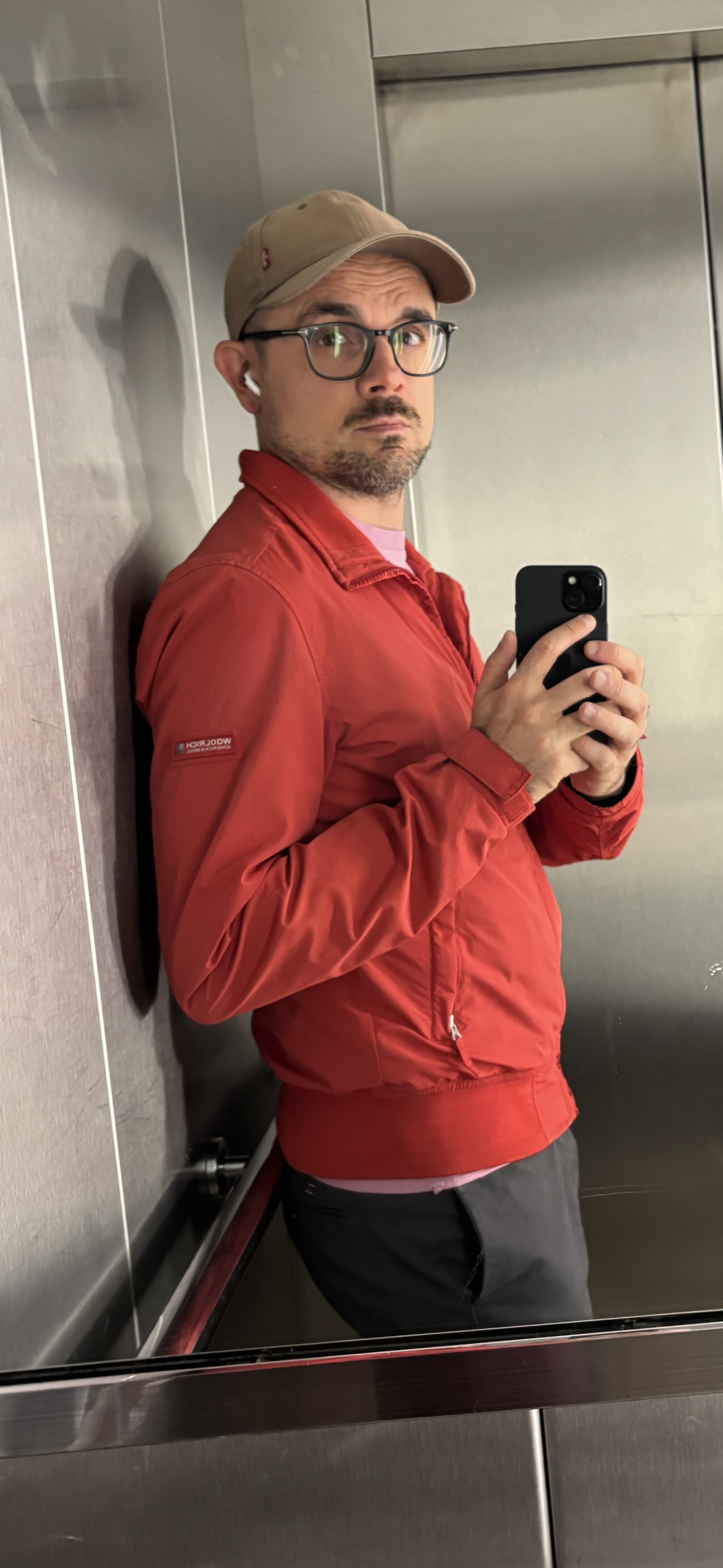 Stefano Anelli in a lift, taking a mirror photo